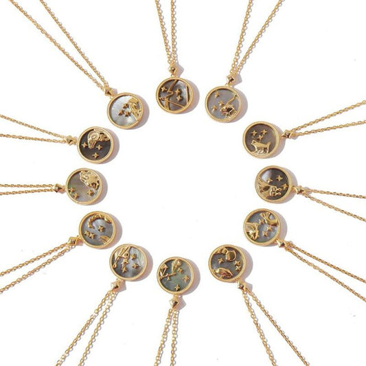 Gold necklaces with zodiac constellations on a white background