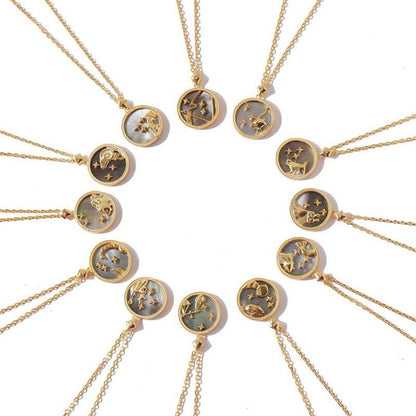 Gold necklaces with zodiac constellations on a white background